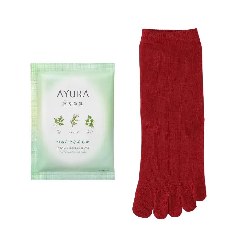 Red toe-separated socks next to a green Ayura product on a light purple background