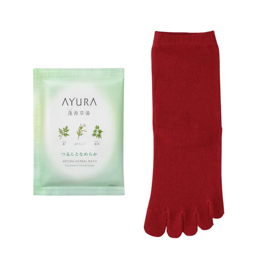 Red toe-separated socks next to a green Ayura product on a light purple background
