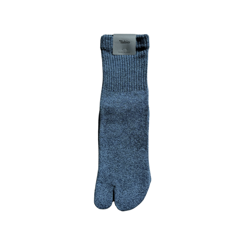 Blue tabi sock with a visible brand label on a white background